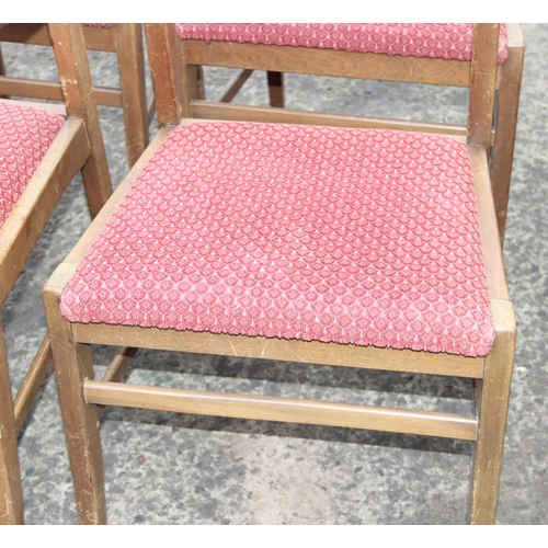 30 - A set of 6 retro dining chairs with red upholstered seats, 4 dining and 2 carver, seemingly unmarked