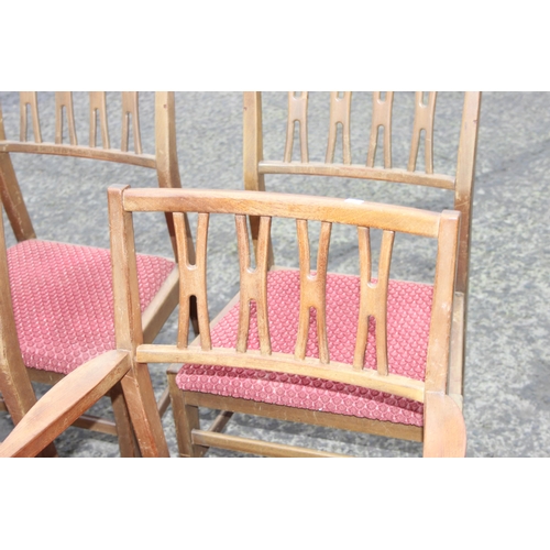 30 - A set of 6 retro dining chairs with red upholstered seats, 4 dining and 2 carver, seemingly unmarked