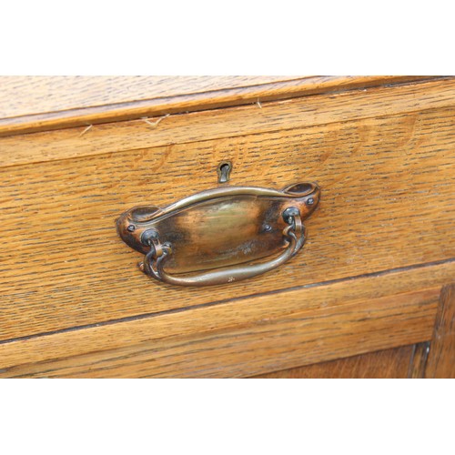 25 - An early 20th century light oak bureau, approx 107cm wide x 50cm deep x 104cm tall