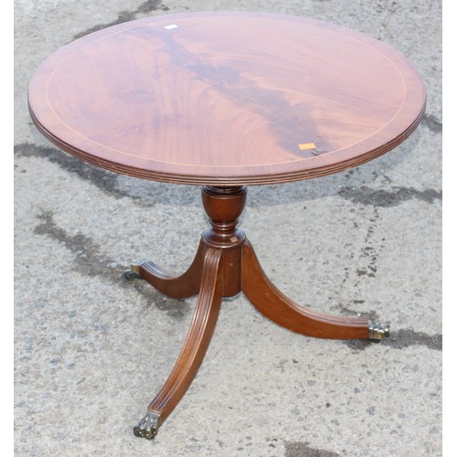 56 - A small antique style mahogany tilt top table, approx 63cm wide x 53cm tall