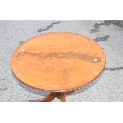 56 - A small antique style mahogany tilt top table, approx 63cm wide x 53cm tall