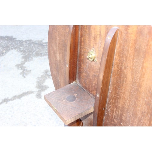 56 - A small antique style mahogany tilt top table, approx 63cm wide x 53cm tall