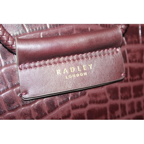 213 - A vintage Radley crocodile effect leather handbag with dust bag and strap, approx 24cm wide