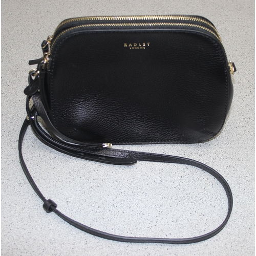 214 - A vintage Radley black leather handbag with dust bag and strap, approx 24cm wide