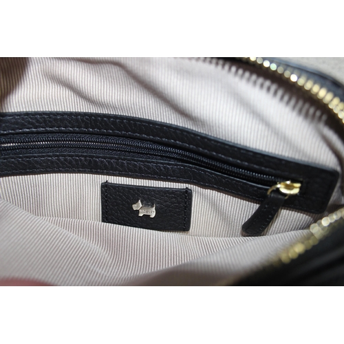 214 - A vintage Radley black leather handbag with dust bag and strap, approx 24cm wide