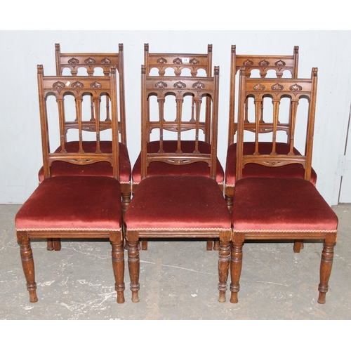 24 - A set of 6 Art Nouveau period oak dining chairs with carved details and upholstered seats, each appr... 