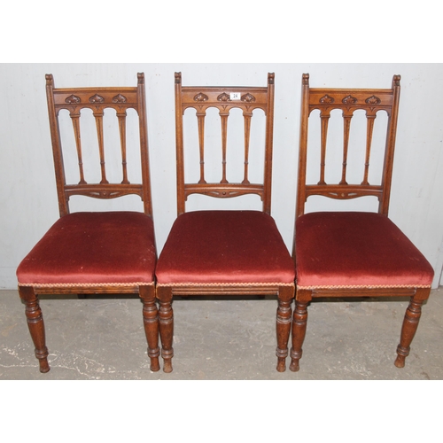 24 - A set of 6 Art Nouveau period oak dining chairs with carved details and upholstered seats, each appr... 