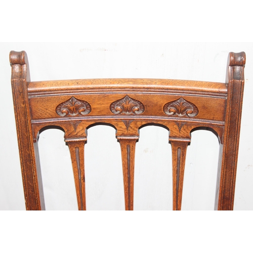 24 - A set of 6 Art Nouveau period oak dining chairs with carved details and upholstered seats, each appr... 