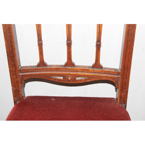 24 - A set of 6 Art Nouveau period oak dining chairs with carved details and upholstered seats, each appr... 