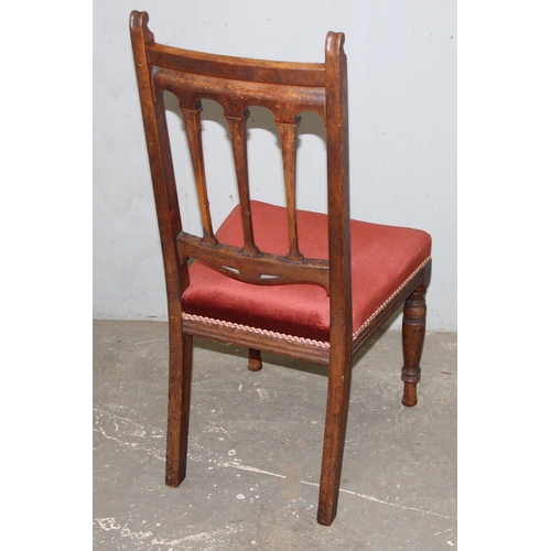 24 - A set of 6 Art Nouveau period oak dining chairs with carved details and upholstered seats, each appr... 