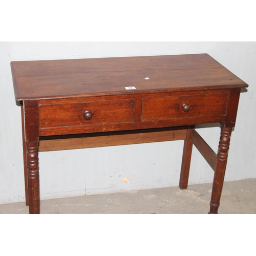 25 - An antique mahogany side or console table with 2 drawers and turned legs, approx 91cm wide x 43cm de... 