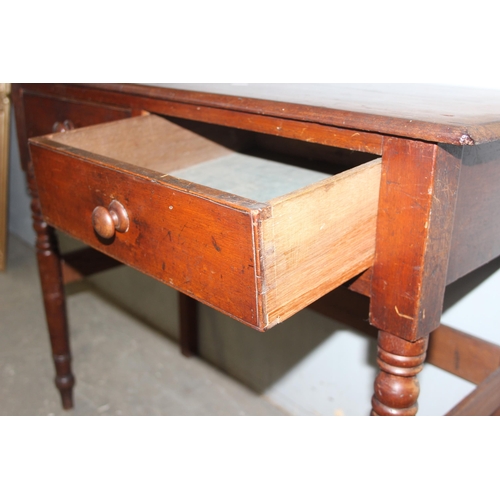 25 - An antique mahogany side or console table with 2 drawers and turned legs, approx 91cm wide x 43cm de... 