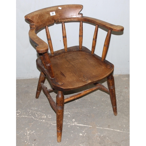 26 - A pair of vintage Oak smoker's bow or captain's armchairs, dated 1934/1935 to seat, made by O Haines... 