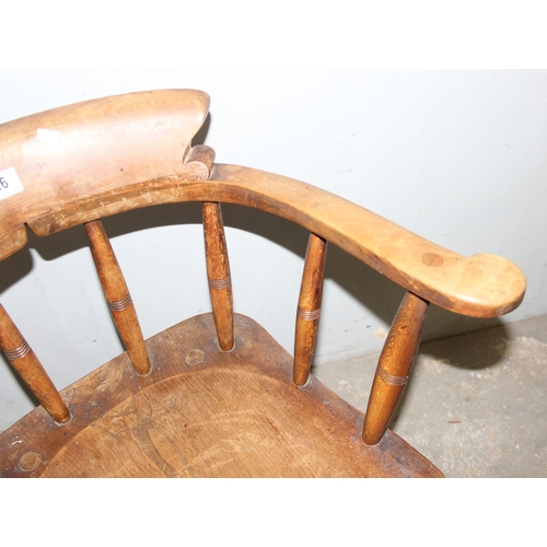 26 - A pair of vintage Oak smoker's bow or captain's armchairs, dated 1934/1935 to seat, made by O Haines... 