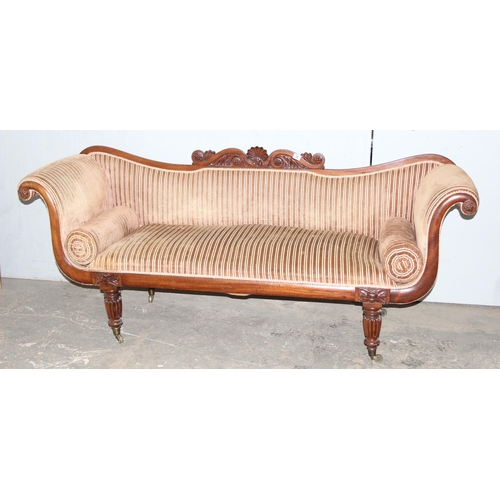 28 - A Regency period mahogany scroll arm sofa, circa 1820, the undulating back, arms, squab and bolster ... 