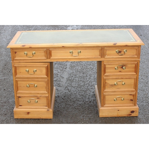 12 - A modern pine 3 part pedestal desk with 9 drawers and tooled leather top, approx 106cm wide x 52cm d... 