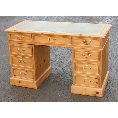 12 - A modern pine 3 part pedestal desk with 9 drawers and tooled leather top, approx 106cm wide x 52cm d... 