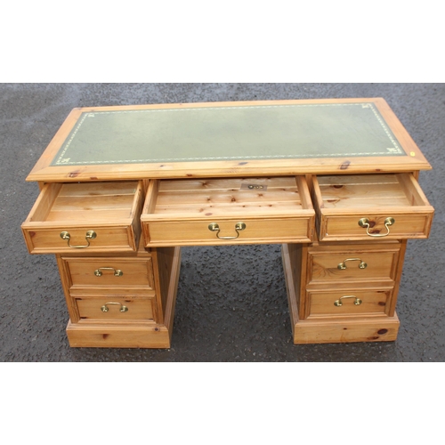 12 - A modern pine 3 part pedestal desk with 9 drawers and tooled leather top, approx 106cm wide x 52cm d... 