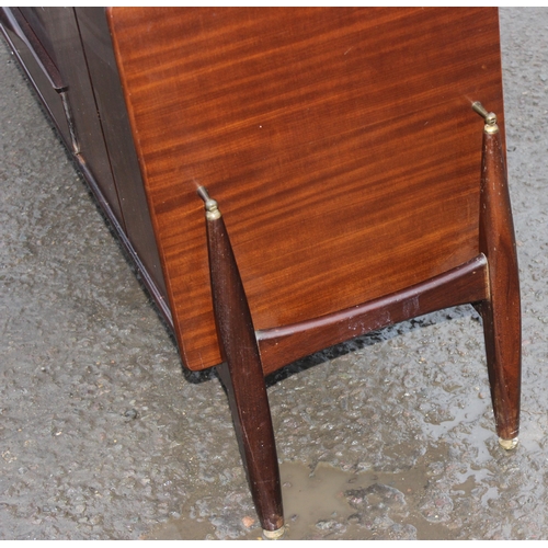 10 - An Elliotts of Newbury mid-century zebrano teak rosewood effect 'floating' sideboard, with four cent... 