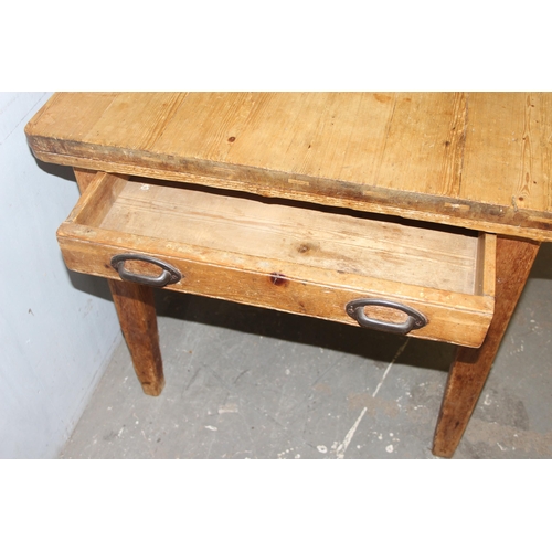 7 - An antique pine farmhouse kitchen table with single drawer, approx 137cm wide x 79cm deep x 78cm tal... 