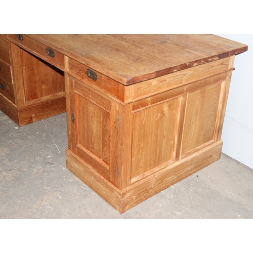 34 - A vintage pedestal desk with brass campaign style handles, 6 drawers and a cupboard, approx 176cm wi... 