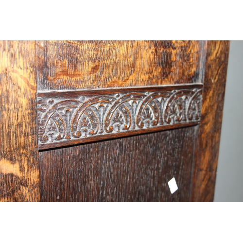 41 - An early 20th century oak wardrobe with mirrored door and carved details, approx 128cm wide x 53cm d... 