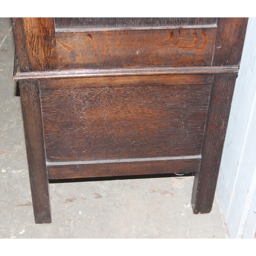 41 - An early 20th century oak wardrobe with mirrored door and carved details, approx 128cm wide x 53cm d... 