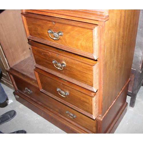 42 - An early 20th century mahogany gentleman's wardrobe with carved details and mirrored drawer, the rig... 