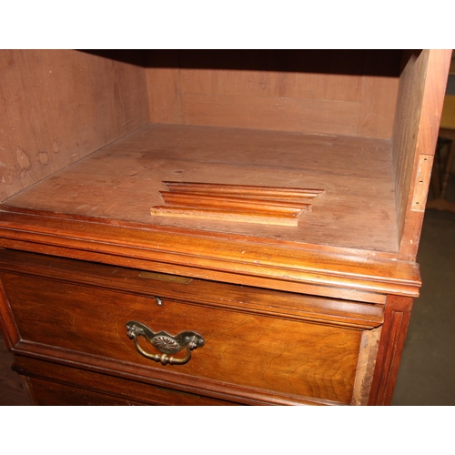 42 - An early 20th century mahogany gentleman's wardrobe with carved details and mirrored drawer, the rig... 