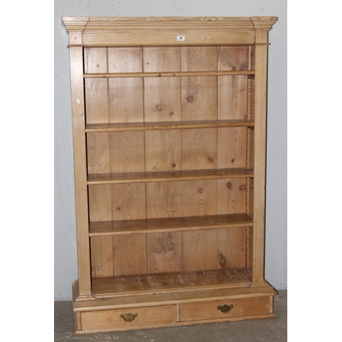 4 - A vintage pine bookcase with 2 short drawers to base, approx 110cm wide x 38cm deep x 162cm tall