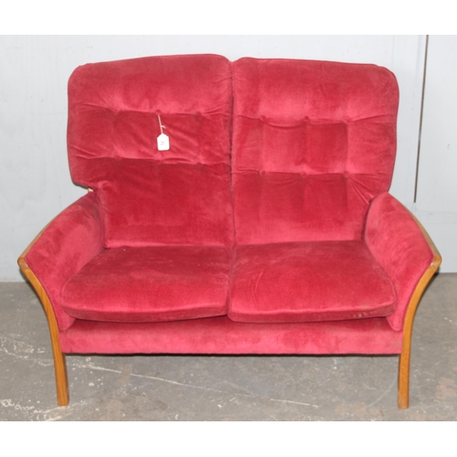 54 - A retro red upholstered Parker Knoll 3 Piece Suite with matching footstool, approx 125cm wide x 83cm... 