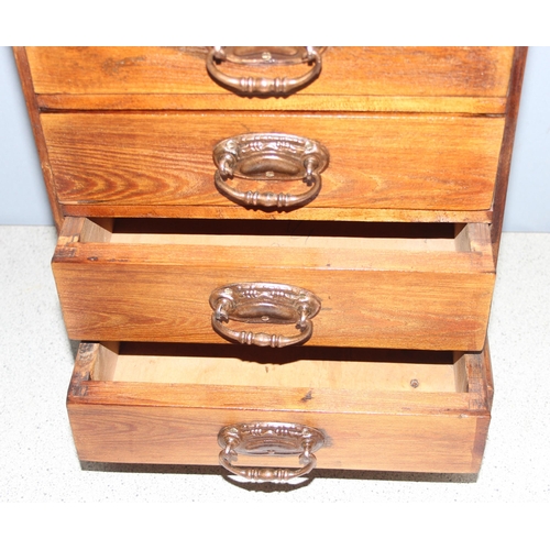 57 - A small vintage stained pine 5 drawer collectors chest with brass handles, approx 30cm wide x 17cm d... 