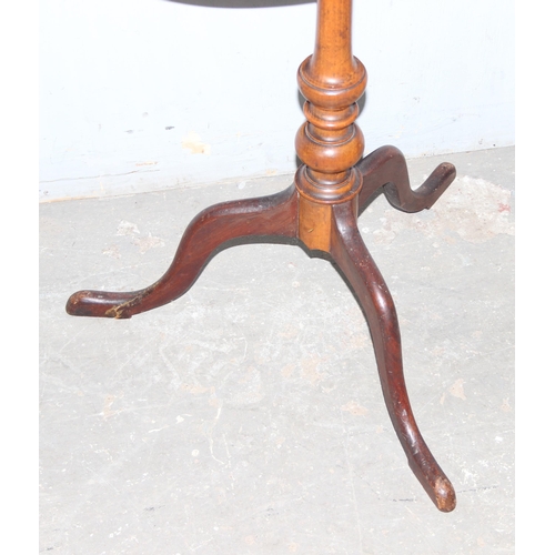 58 - An antique mahogany tilt topped side table with oval top and tripod base, approx 42cm wide x 52cm de... 