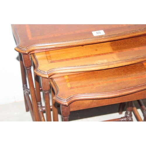 60 - An Edwardian Sheraton Revival period nest of 3 tables, the largest approx 57cm wide x 37cm deep x 67... 