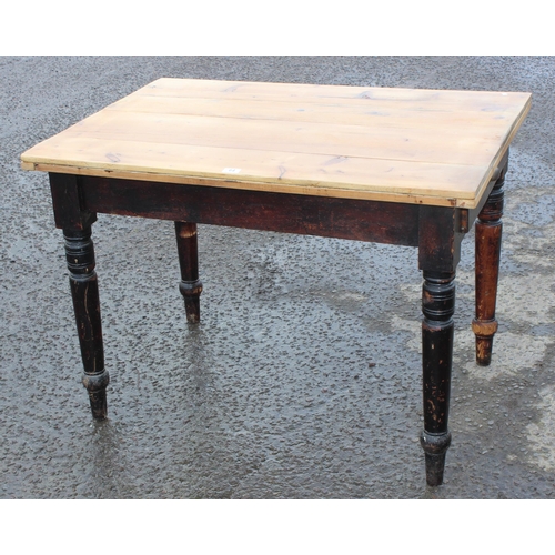 64 - A rustic pine farmhouse kitchen table with single drawer, scrubbed pine top and stained base, approx... 