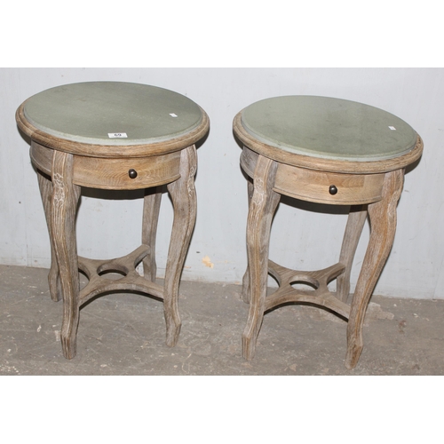 69 - A pair of limed oak and marble topped bedside tables with single drawer, approx 46cm wide x 46cm dee... 