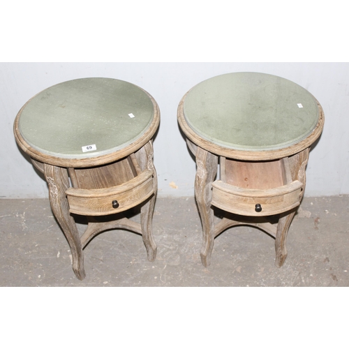 69 - A pair of limed oak and marble topped bedside tables with single drawer, approx 46cm wide x 46cm dee... 