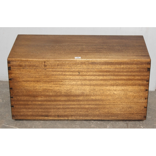 77 - A vintage plain wooden trunk, approx 92cm wide x 45cm deep x 47cm tall