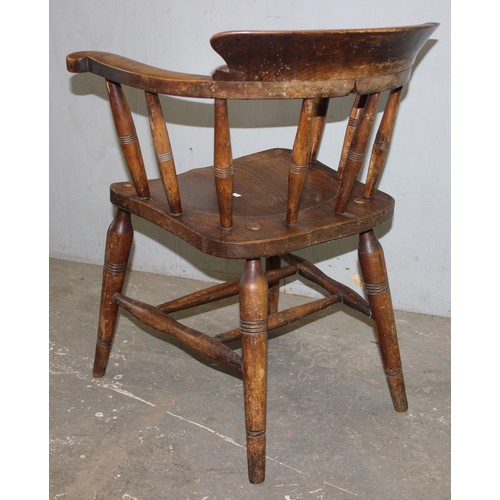 26 - A pair of vintage Oak smoker's bow or captain's armchairs, dated 1934/1935 to seat, made by O Haines... 