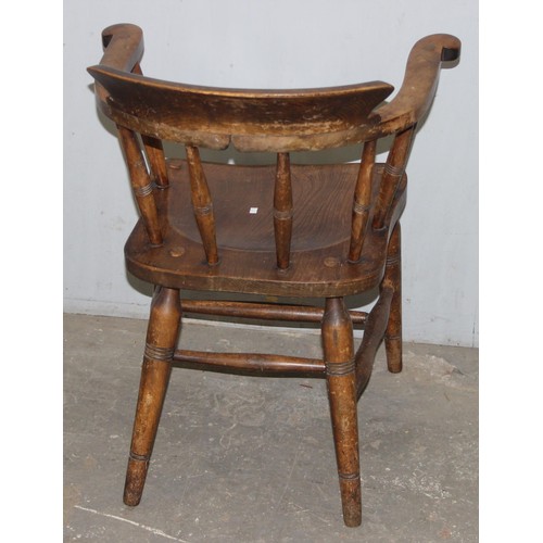 26 - A pair of vintage Oak smoker's bow or captain's armchairs, dated 1934/1935 to seat, made by O Haines... 