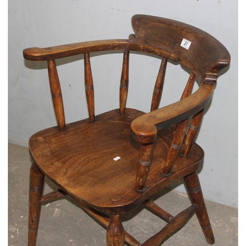 26 - A pair of vintage Oak smoker's bow or captain's armchairs, dated 1934/1935 to seat, made by O Haines... 