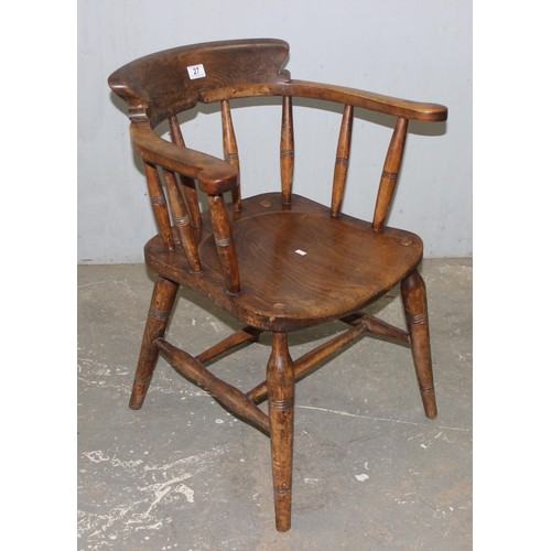 26 - A pair of vintage Oak smoker's bow or captain's armchairs, dated 1934/1935 to seat, made by O Haines... 