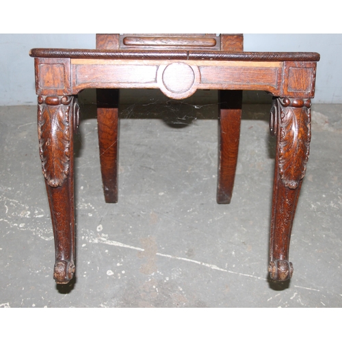 47 - A 19th century carved oak hall chair