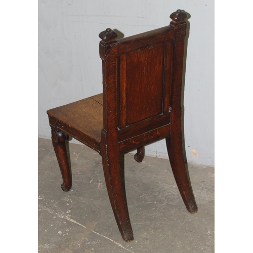 47 - A 19th century carved oak hall chair