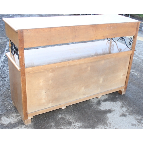 124 - An unusual carved light oak sideboard or buffet stand with 3 drawers above 2 cupboards, the piece wi... 