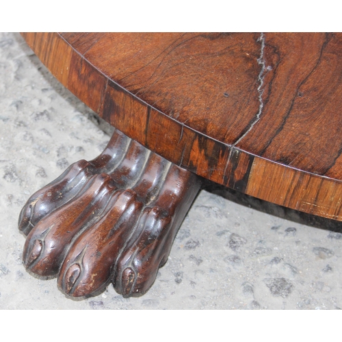 133 - A Victorian rosewood breakfast table with tilt top and impressive pedestal base with paw feet, appro... 