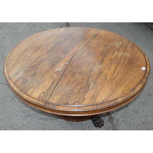 133 - A Victorian rosewood breakfast table with tilt top and impressive pedestal base with paw feet, appro... 