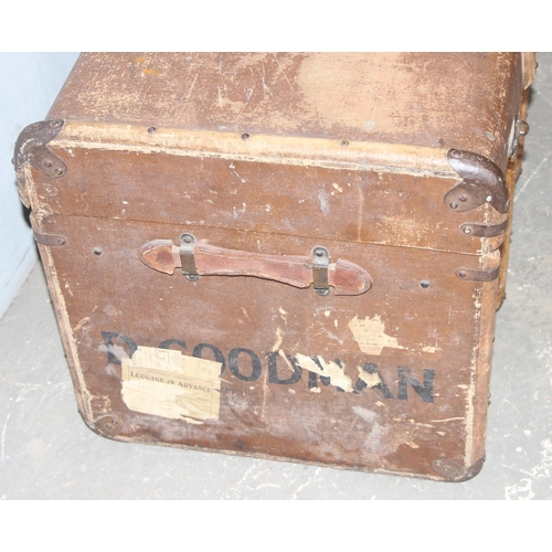142 - A large vintage flat topped steamer trunk with canvas covering and wooden struts, approx 92cm wide x... 