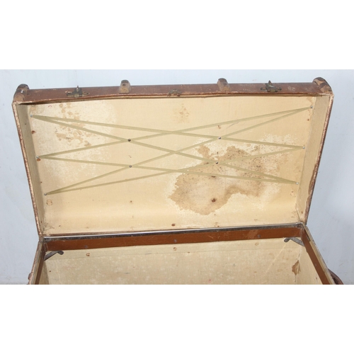142 - A large vintage flat topped steamer trunk with canvas covering and wooden struts, approx 92cm wide x... 
