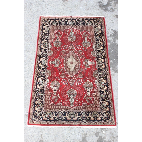 216 - A superb quality hand made Persian silk decorative red ground rug, fine quality knot structure, appr... 